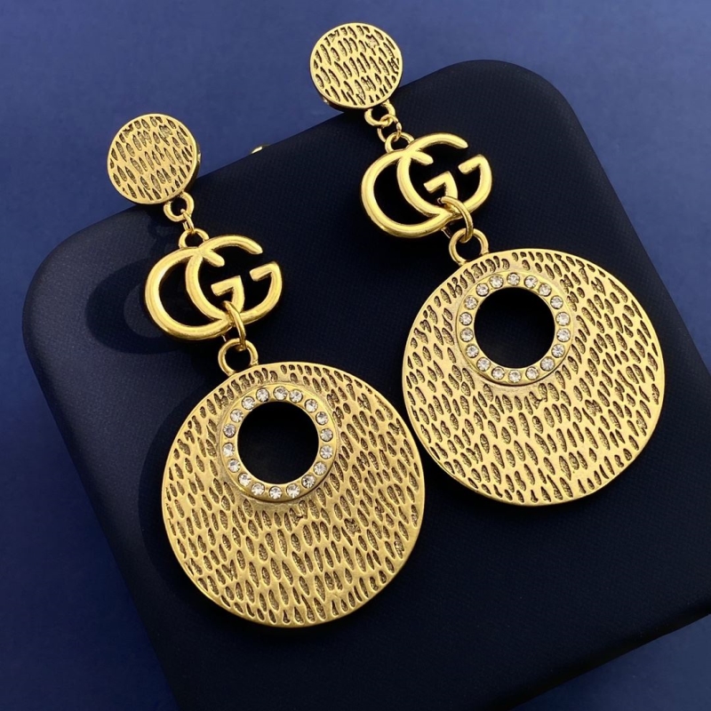 G*u*i earrings